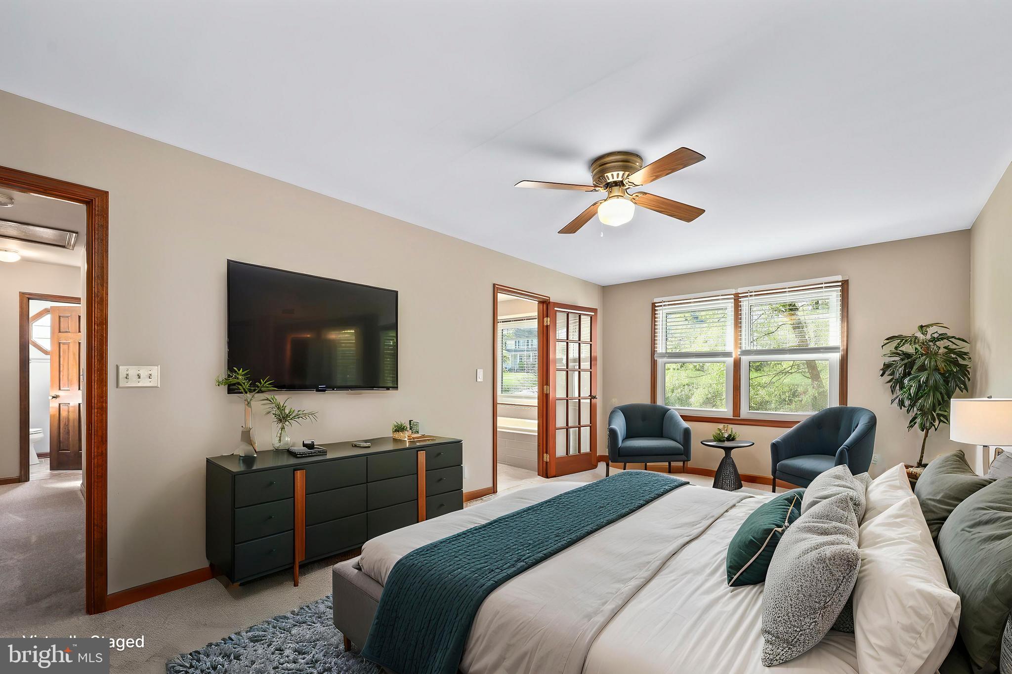 233 Choptank Road Stafford, VA 22556 - Photo 22 of 65 a bedroom with a bed and a flat screen tv