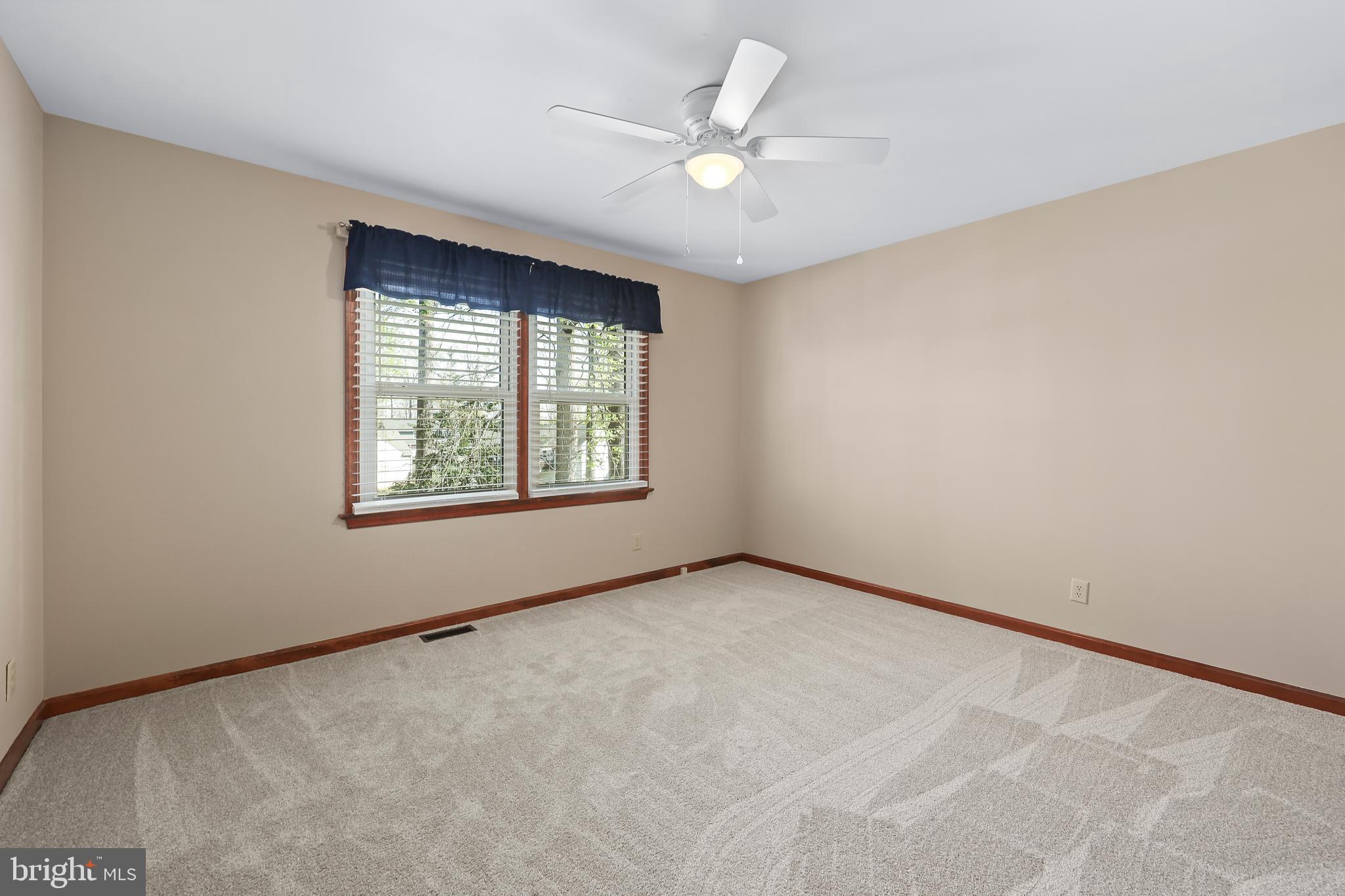 233 Choptank Road Stafford, VA 22556 - Photo 34 of 65 an empty room with windows and ceiling fan view