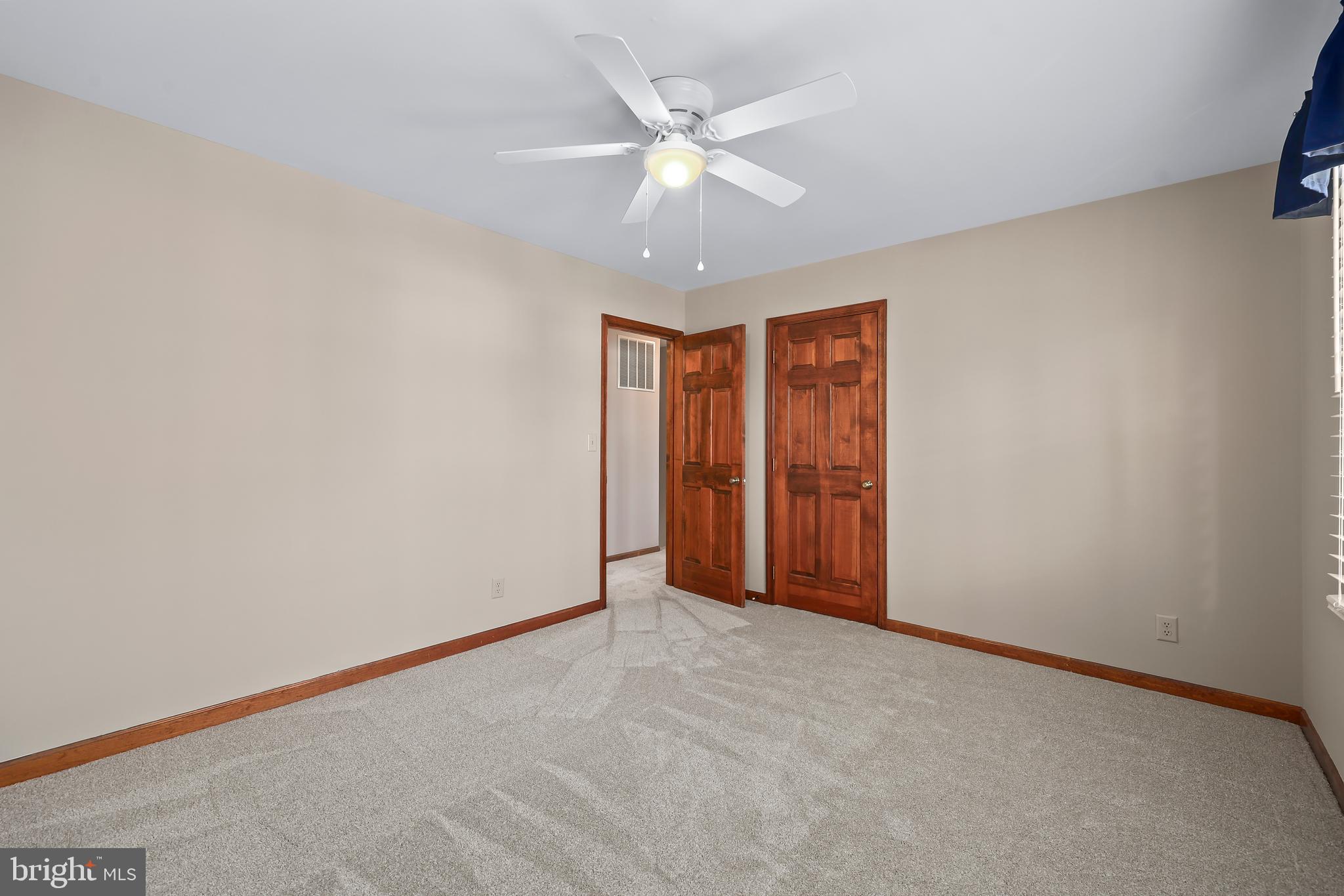 233 Choptank Road Stafford, VA 22556 - Photo 35 of 65 an empty room with closet and ceiling fan