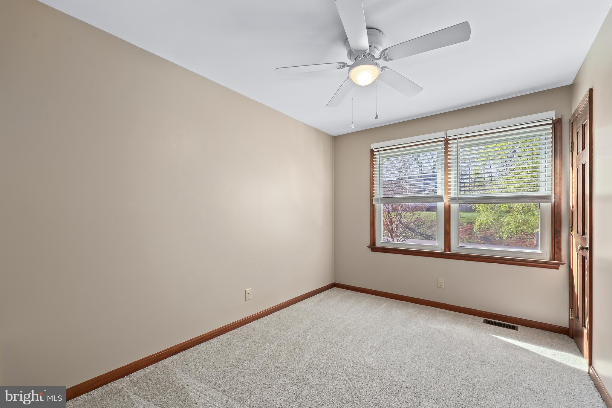 233 Choptank Road Stafford, VA 22556 - Photo 38 of 65 an empty room with windows and ceiling fan