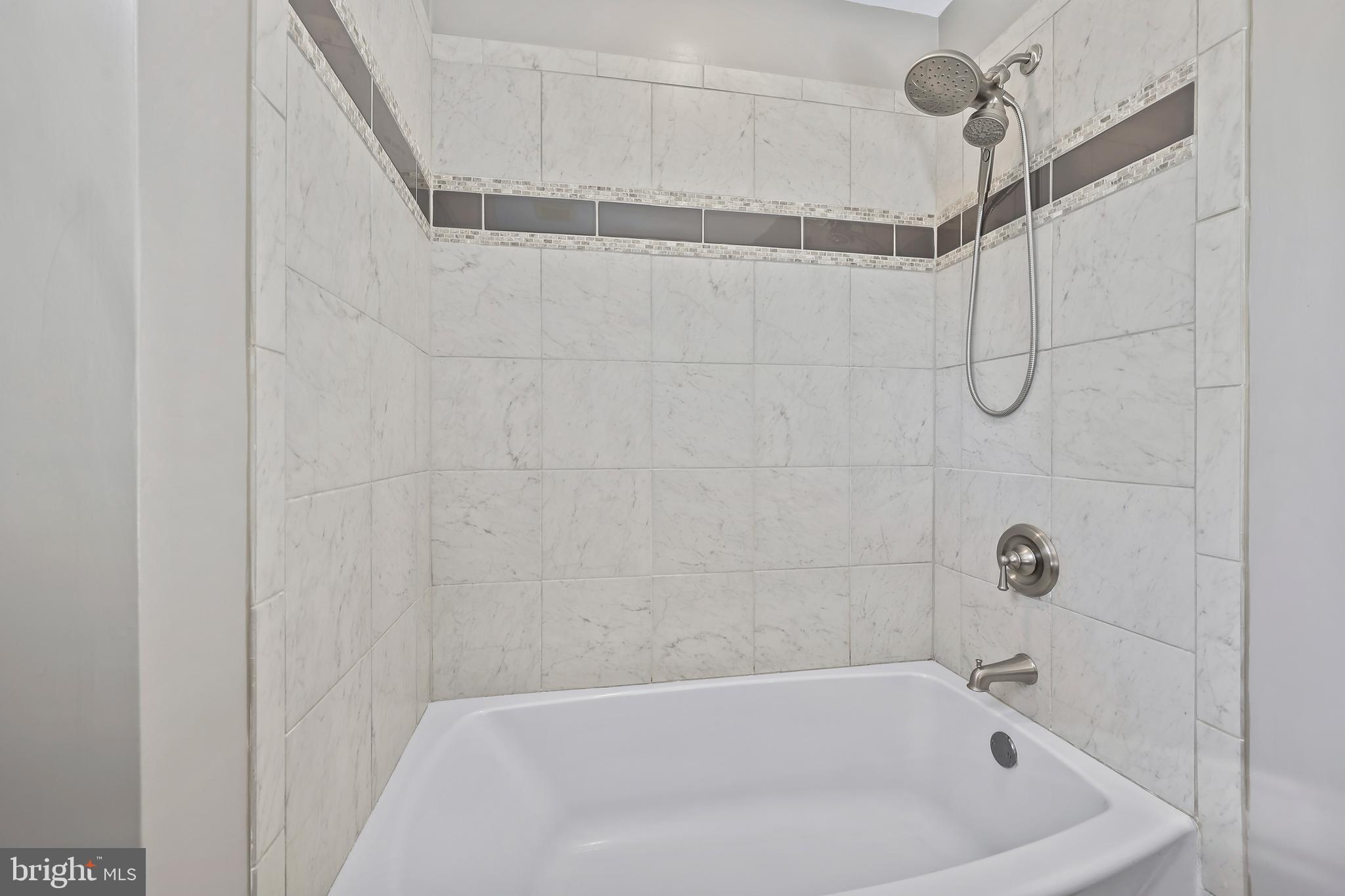 233 Choptank Road Stafford, VA 22556 - Photo 40 of 65 a bathroom with a bath tub and a shower