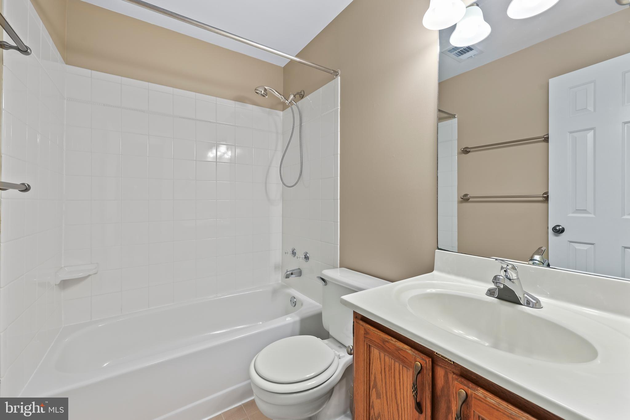 233 Choptank Road Stafford, VA 22556 - Photo 47 of 65 a bathroom with a granite countertop sink toilet and shower
