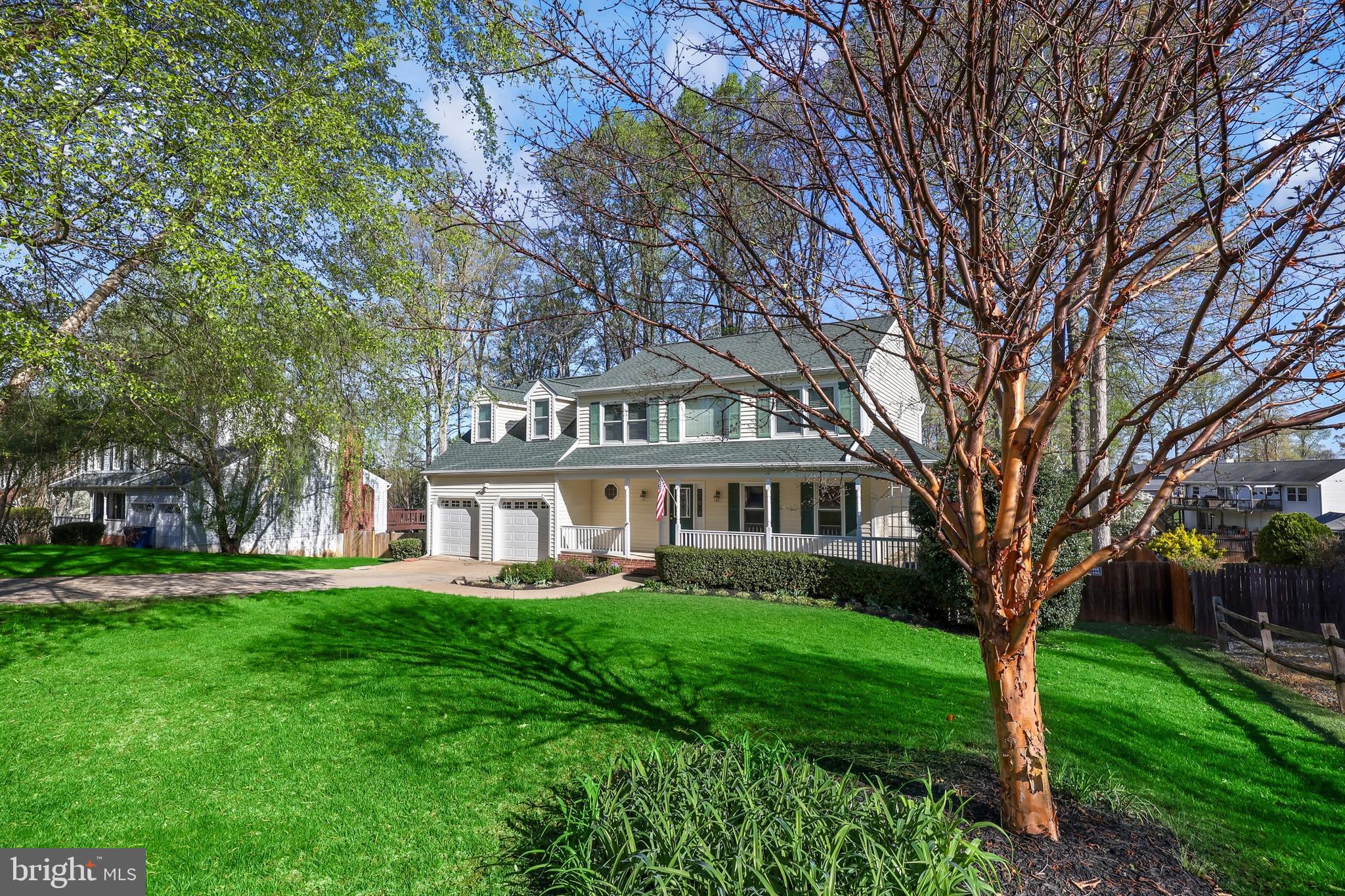 233 Choptank Road Stafford, VA 22556 - Photo 62 of 65 a front view of a house with a garden and trees