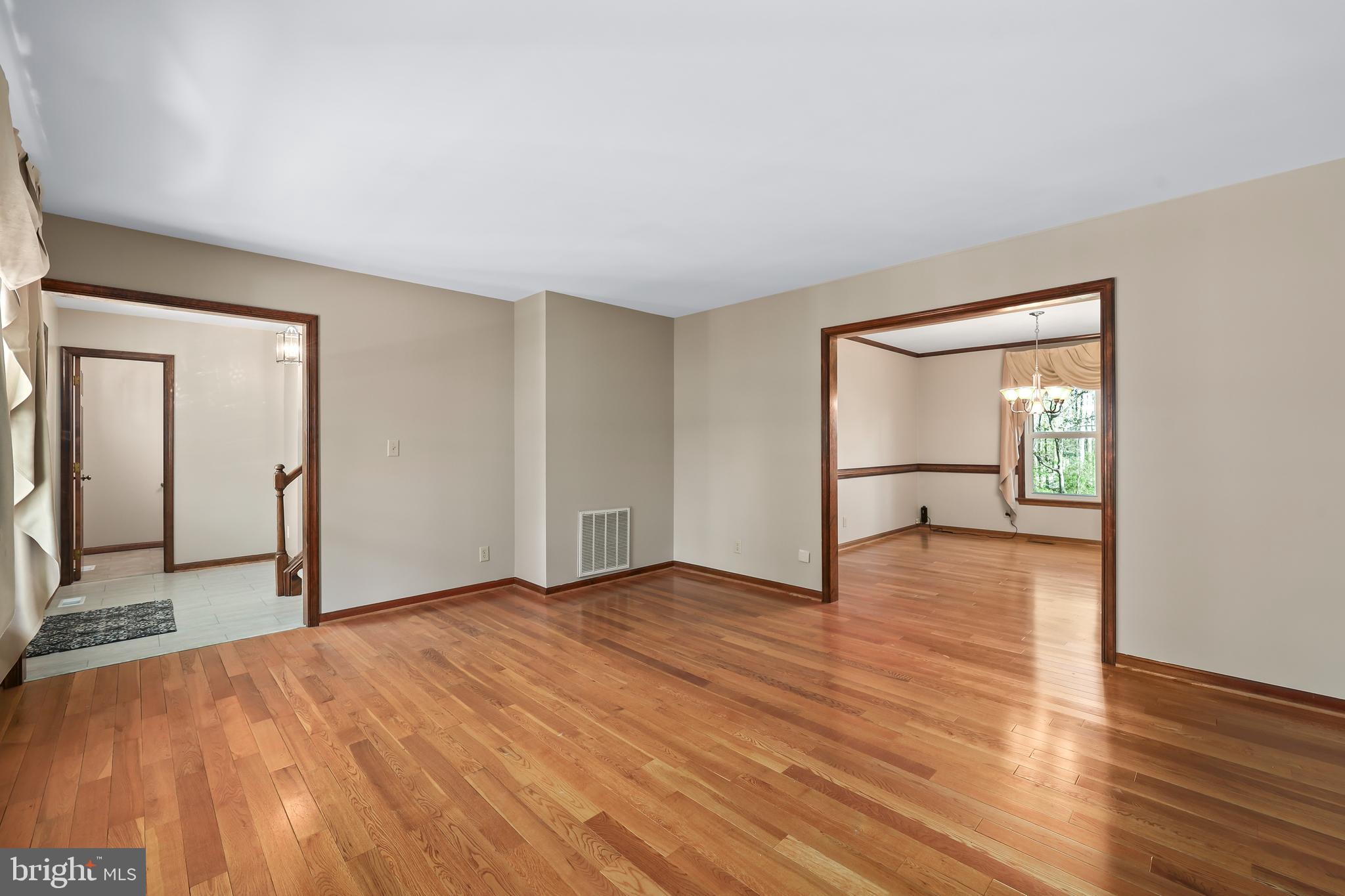 233 Choptank Road Stafford, VA 22556 - Photo 7 of 65 a view of empty room with wooden floor and fan