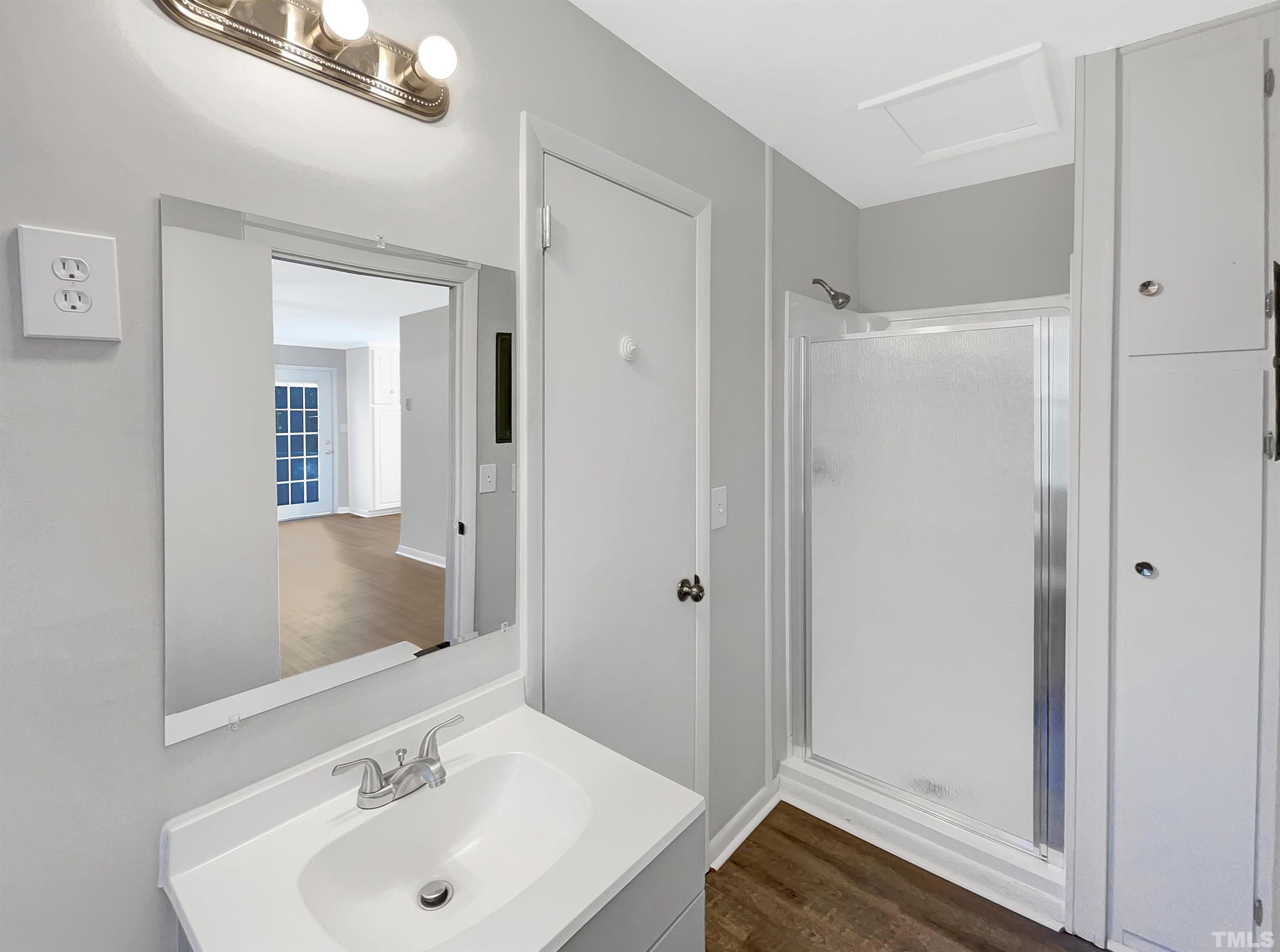 3703 Hester Circle Raleigh, NC 27604 - Photo 9 of 14 a bathroom with a sink and a mirror