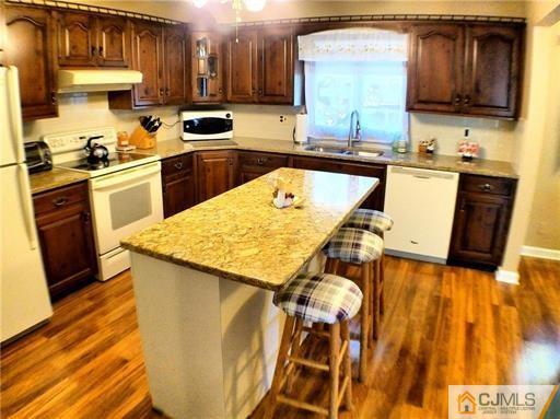 21 Ridge Road Old Bridge, NJ 08857 - Photo 4 of 23 a kitchen with a sink a stove and cabinets