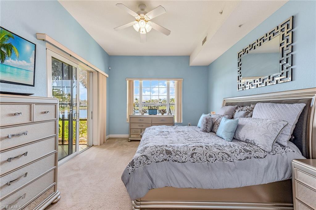 9275 Museo Circle, Unit 103 Naples, FL 34114 - Photo 13 of 49 a bedroom with a large bed and a window