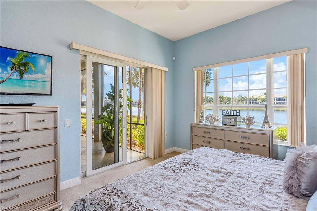 9275 Museo Circle, Unit 103 Naples, FL 34114 - Photo 14 of 49 a bedroom with a bed and a dresser next to a window