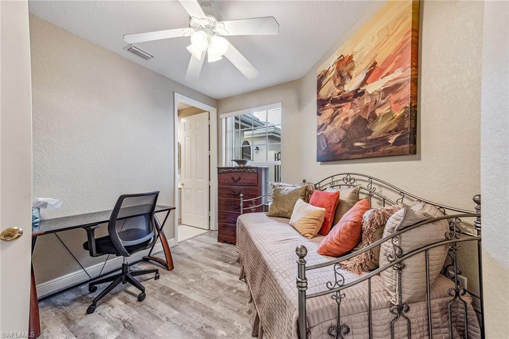 9275 Museo Circle, Unit 103 Naples, FL 34114 - Photo 19 of 49 a bedroom with a bed and furniture