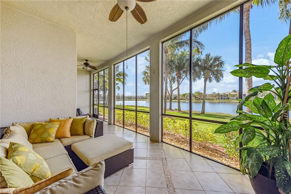 9275 Museo Circle, Unit 103 Naples, FL 34114 - Photo 22 of 49 a living room with furniture and a large window