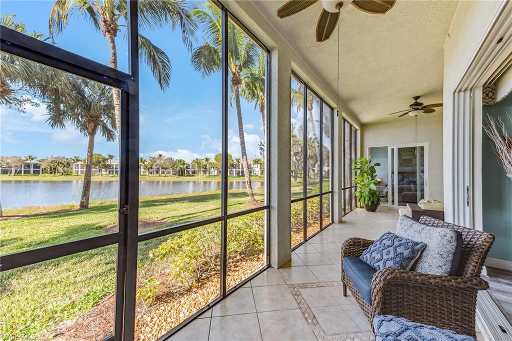 9275 Museo Circle, Unit 103 Naples, FL 34114 - Photo 23 of 49 a living room with furniture and a floor to ceiling window