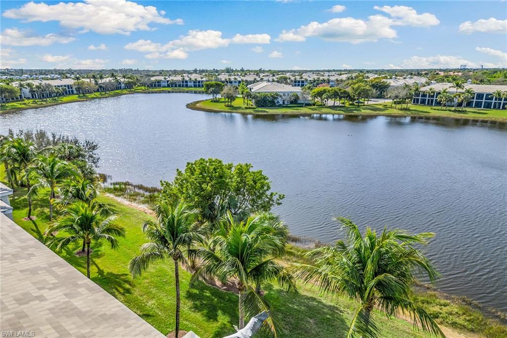 9275 Museo Circle, Unit 103 Naples, FL 34114 - Photo 24 of 49 a view of a lake with a city