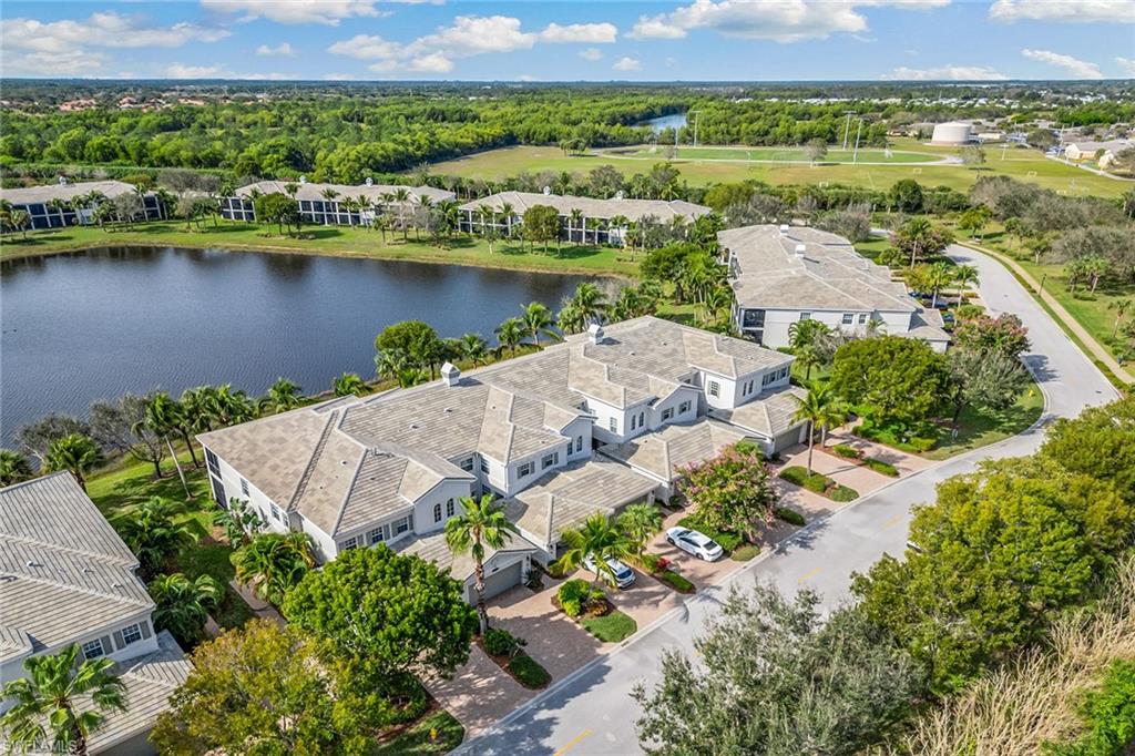 9275 Museo Circle, Unit 103 Naples, FL 34114 - Photo 29 of 49 an aerial view of a city with lake view