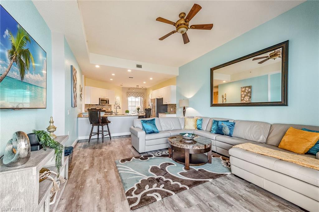 9275 Museo Circle, Unit 103 Naples, FL 34114 - Photo 6 of 49 a living room with furniture and a view of kitchen