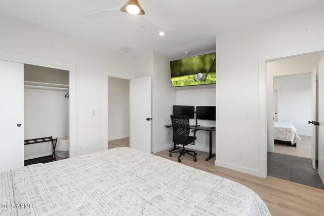 a bedroom with a bed and a lamp