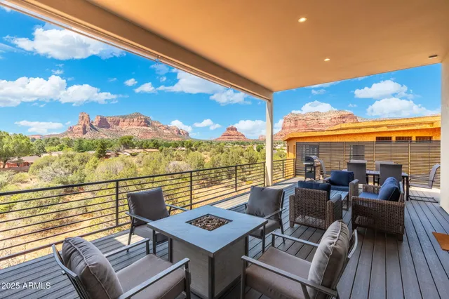 a view of a balcony with chairs