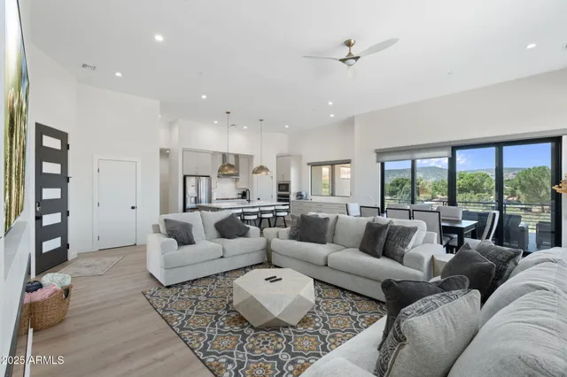 a view of a balcony with a large window and a potted plant