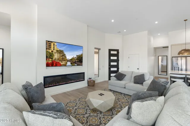 a kitchen with granite countertop a sink a counter top space stainless steel appliances and cabinets