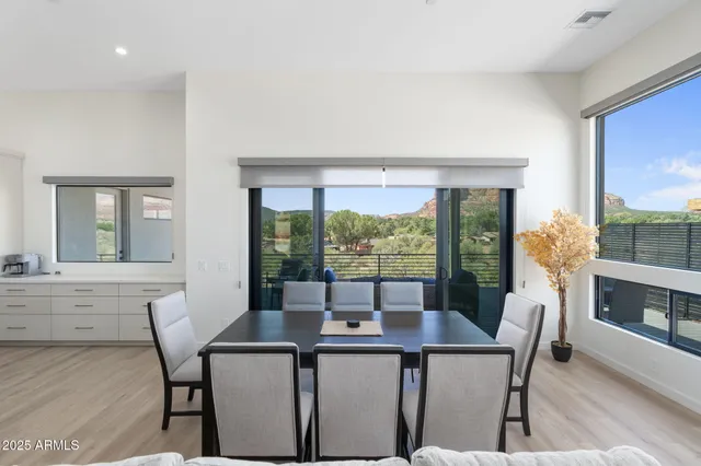 a kitchen with stainless steel appliances a sink a stove and cabinets