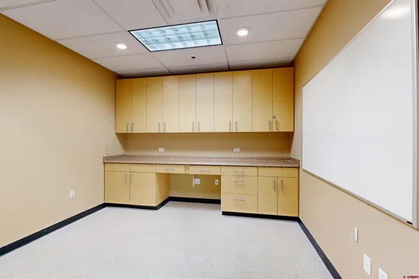 a view of a city with lush green space