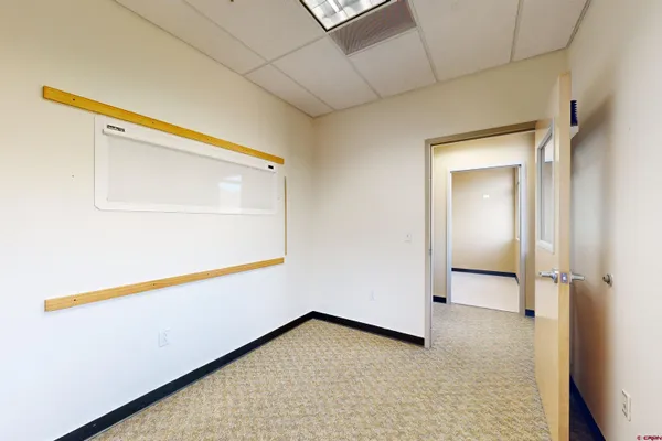 a view of an empty room with windows