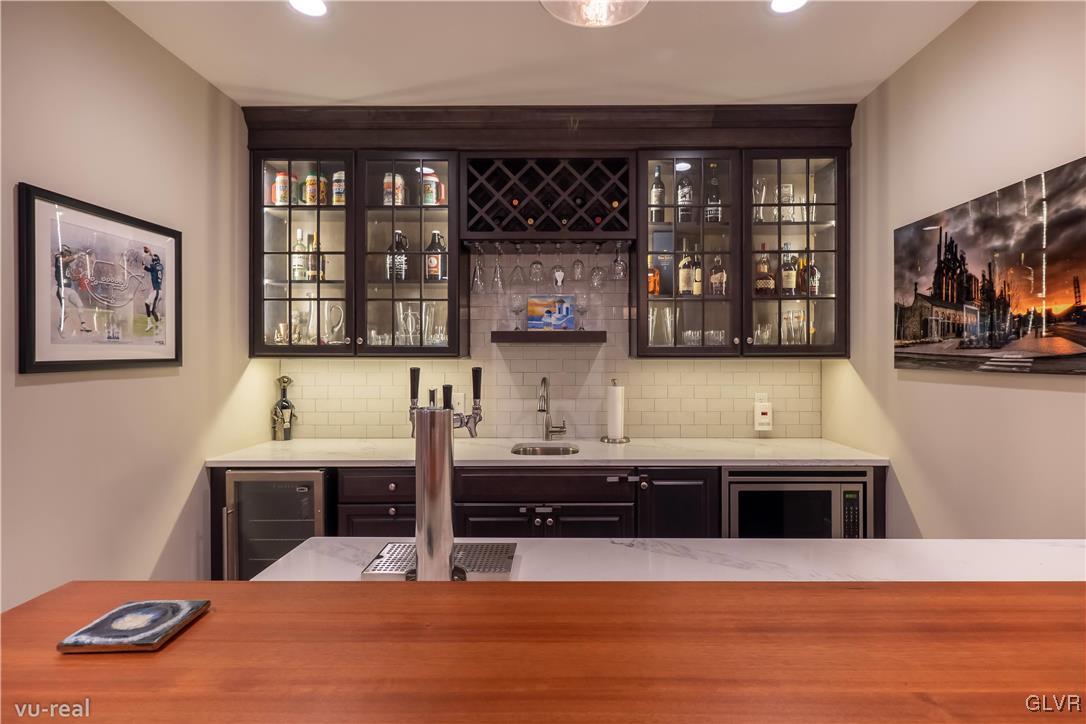 2723 Monacacy Road Nazareth, PA 18064 - Photo 42 of 49 Basement wet bar, wine fridge, kitchen