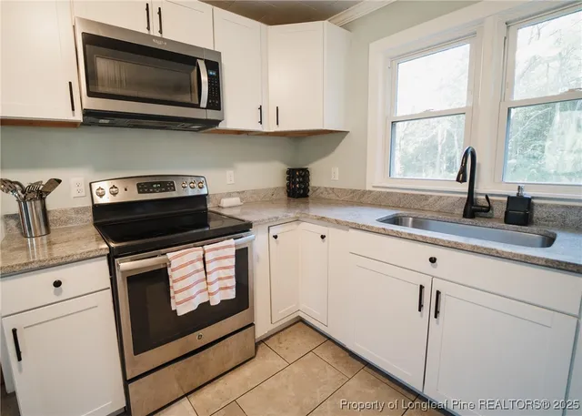 a view of a dining room with furniture and window