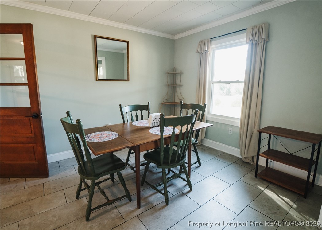 9778 Highway 24 Carthage, NC 28327 - Photo 22 of 47 a view of a dining room with furniture and window