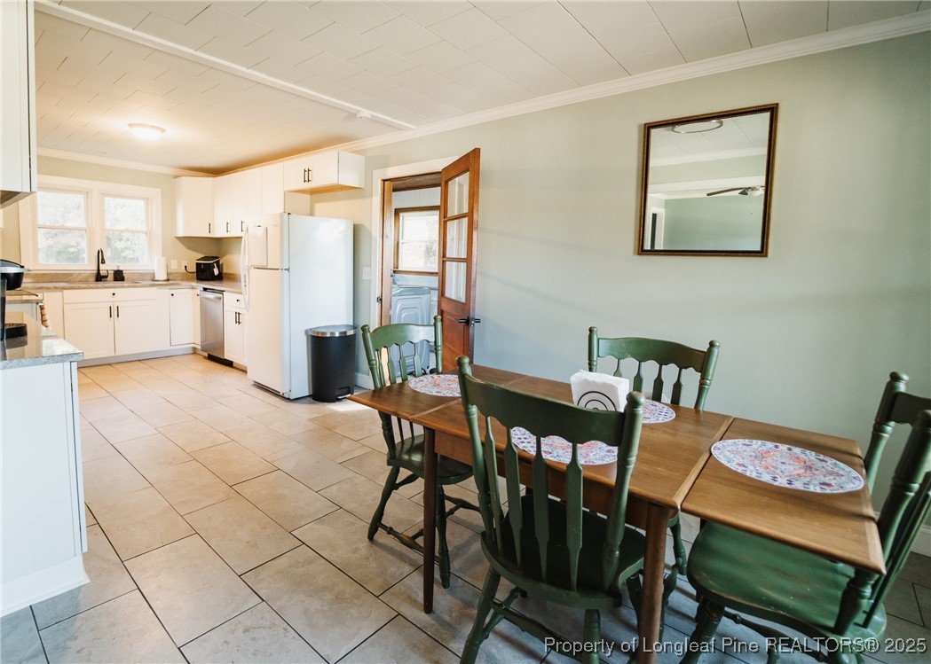 9778 Highway 24 Carthage, NC 28327 - Photo 23 of 47 a view of a dining room with furniture and a table