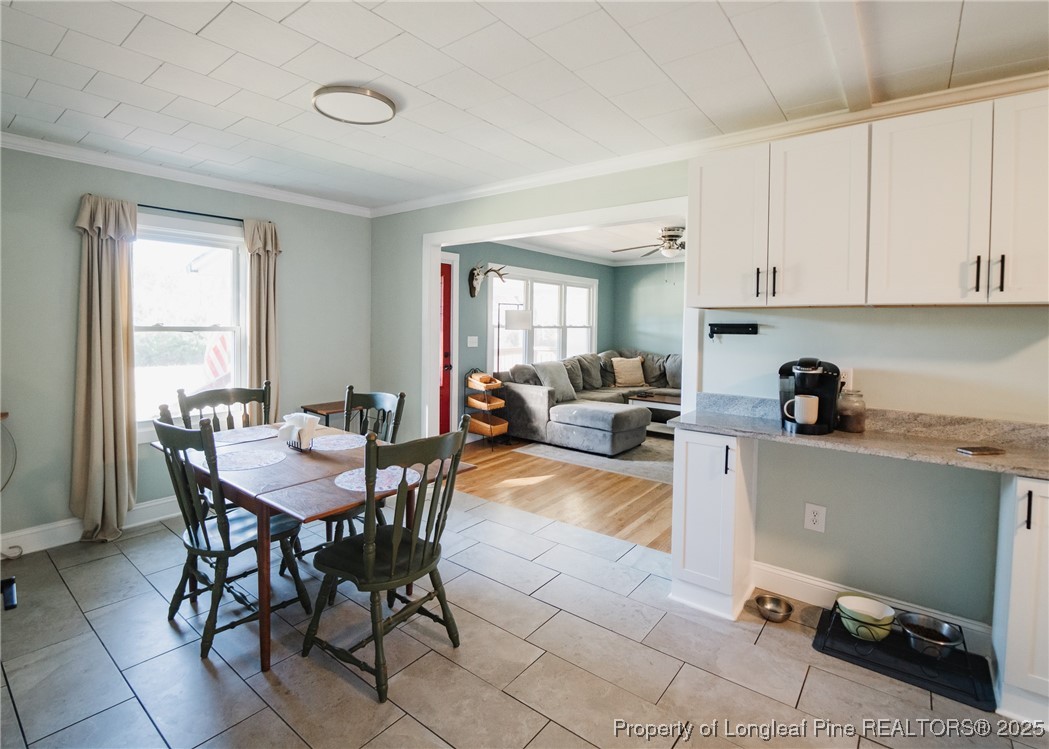 9778 Highway 24 Carthage, NC 28327 - Photo 26 of 47 a view of a dining room with furniture and a window