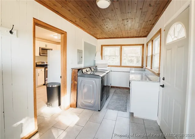 a front view of a house with a garden and deck