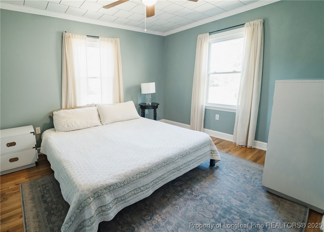 9778 Highway 24 Carthage, NC 28327 - Photo 32 of 47 a bedroom with a bed and a window