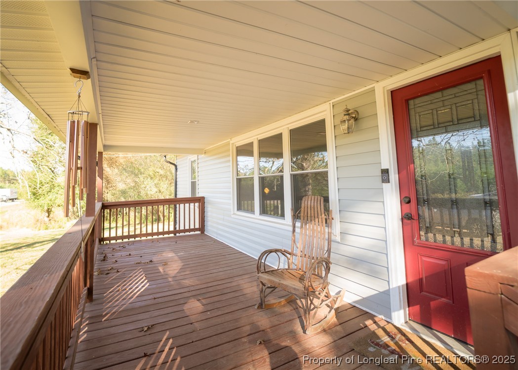 9778 Highway 24 Carthage, NC 28327 - Photo 4 of 47 a view of a porch with wooden floor and outdoor space