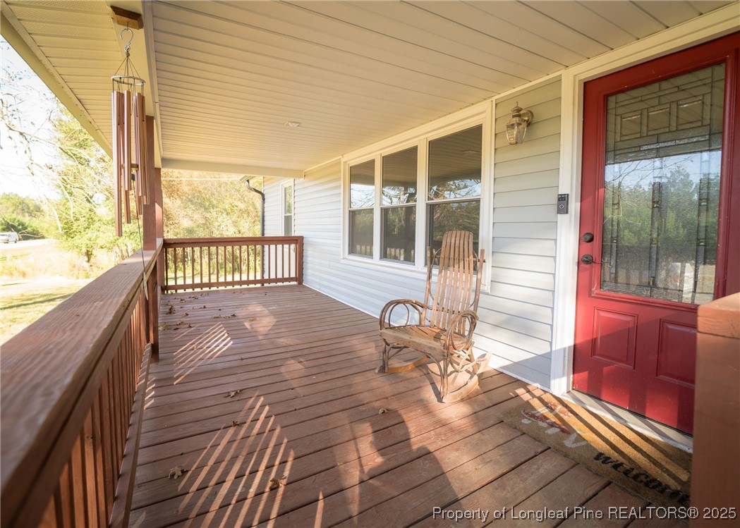 9778 Highway 24 Carthage, NC 28327 - Photo 5 of 47 a balcony with wooden floor