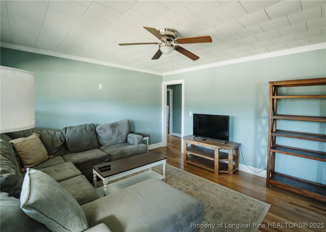 9778 Highway 24 Carthage, NC 28327 - Photo 8 of 47 a living room with furniture and a flat screen tv