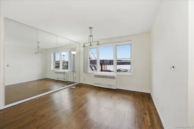 a kitchen with granite countertop a sink and cabinets