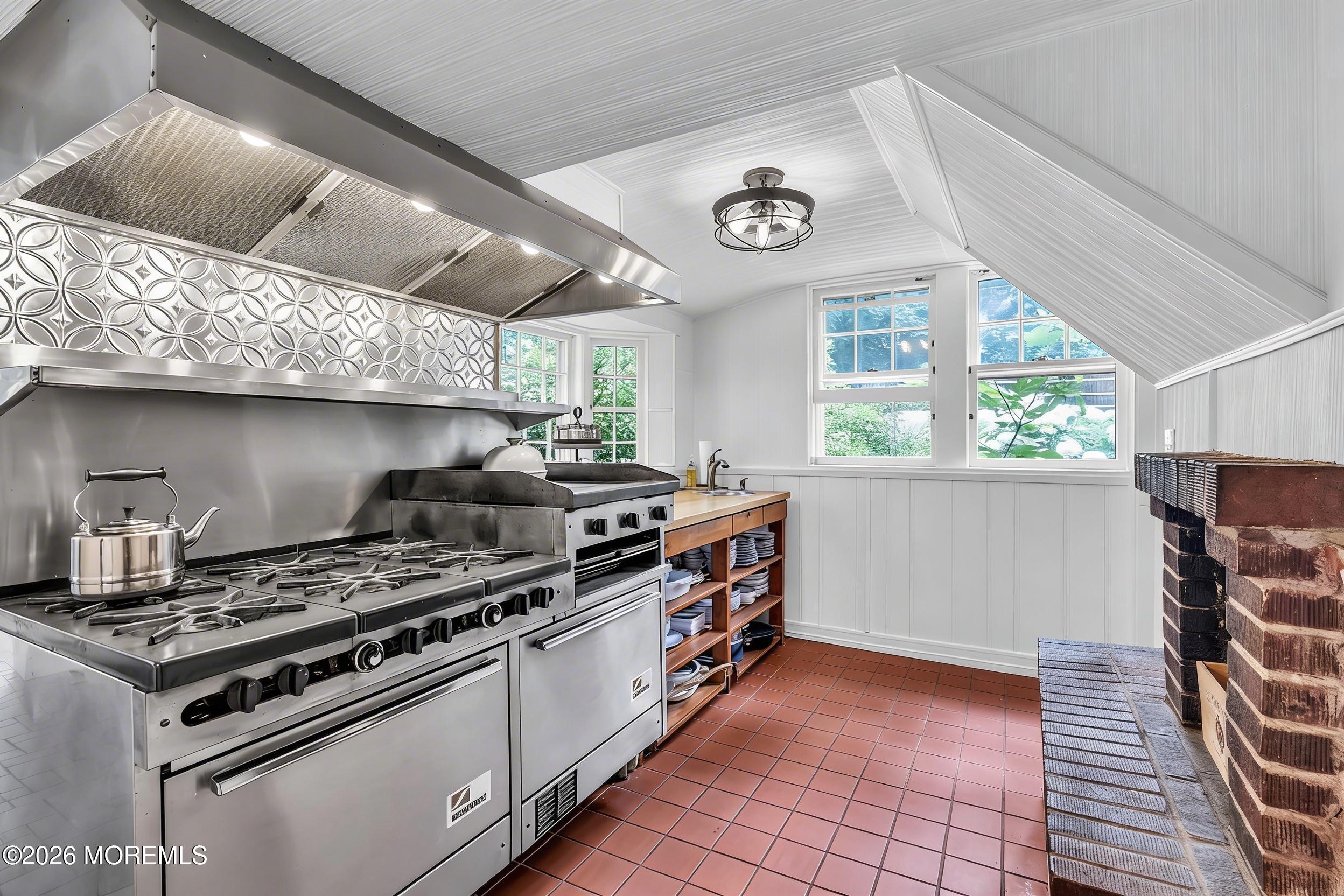 2041 Raritan Road Scotch Plains, NJ 07076 - Photo 21 of 106 a kitchen with a stove and a clock