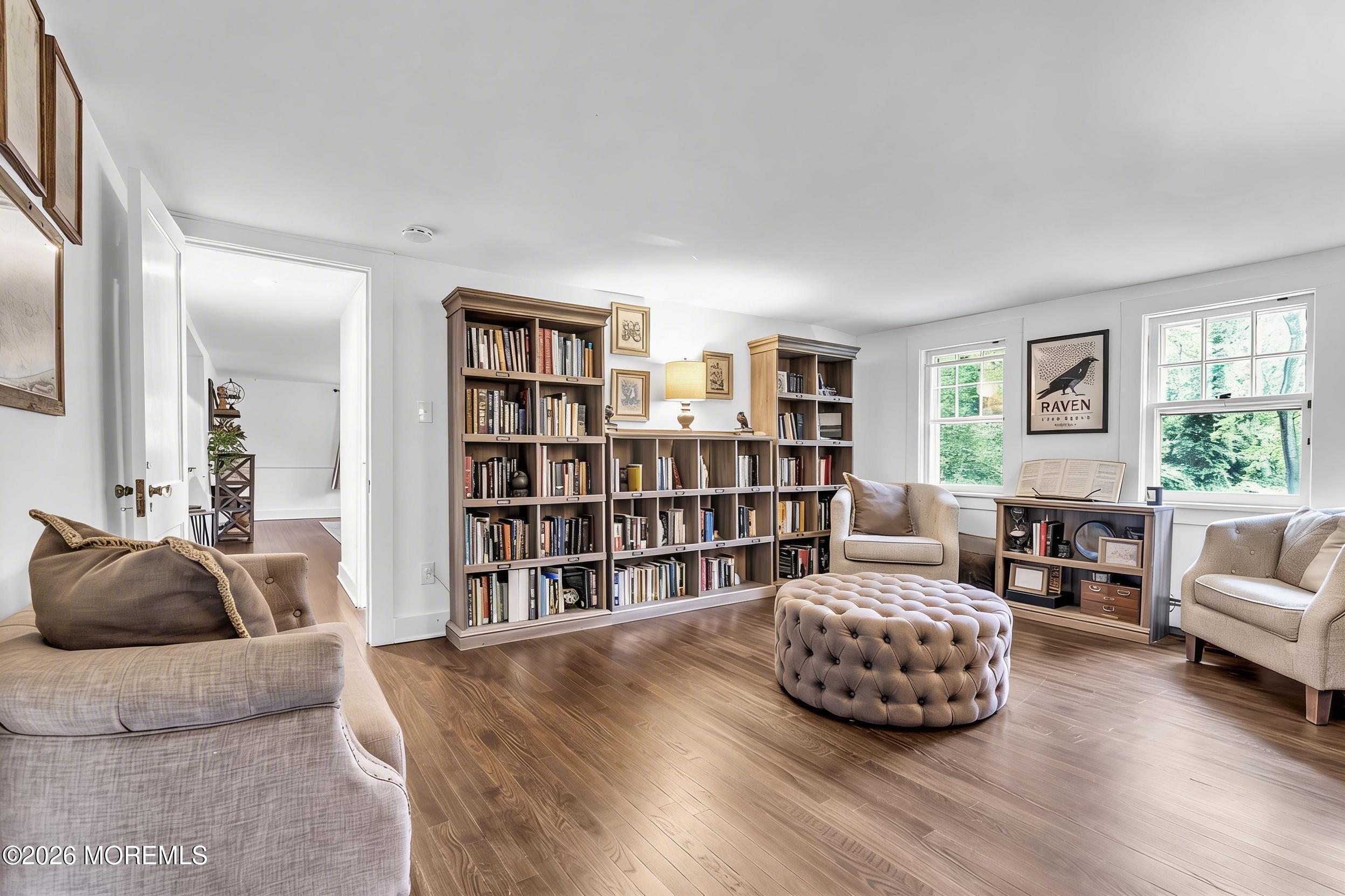 2041 Raritan Road Scotch Plains, NJ 07076 - Photo 27 of 106 a living room with furniture and a book shelf