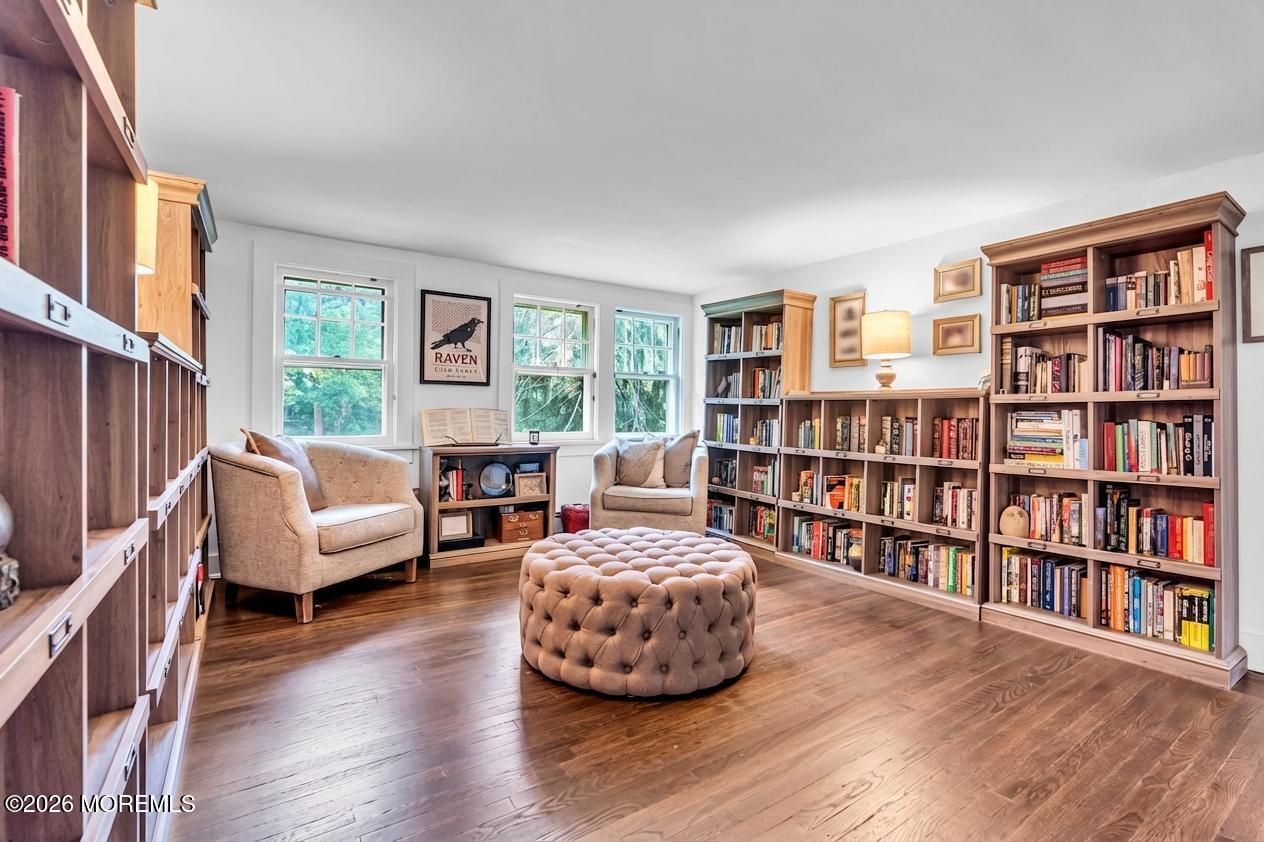 2041 Raritan Road Scotch Plains, NJ 07076 - Photo 28 of 106 a living room with furniture and a book shelf