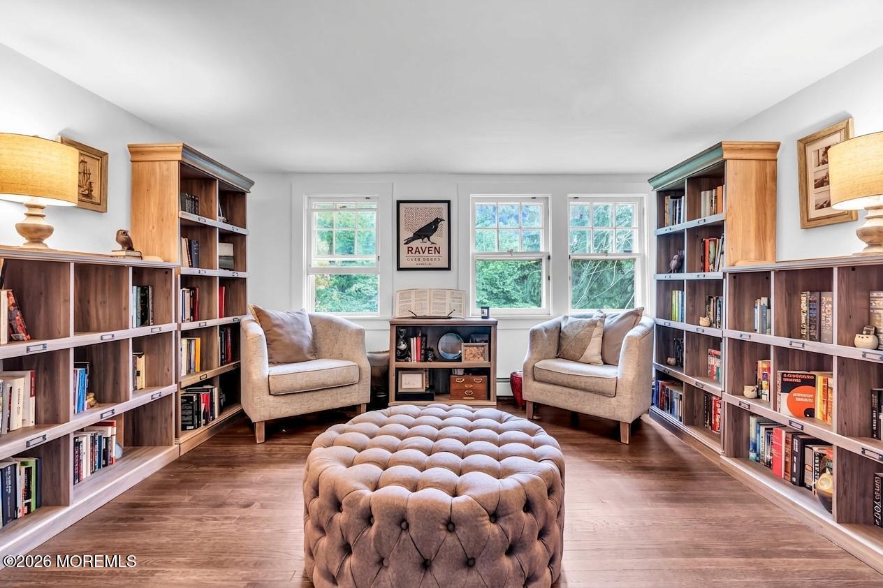 2041 Raritan Road Scotch Plains, NJ 07076 - Photo 29 of 106 a living room with furniture and a book shelf