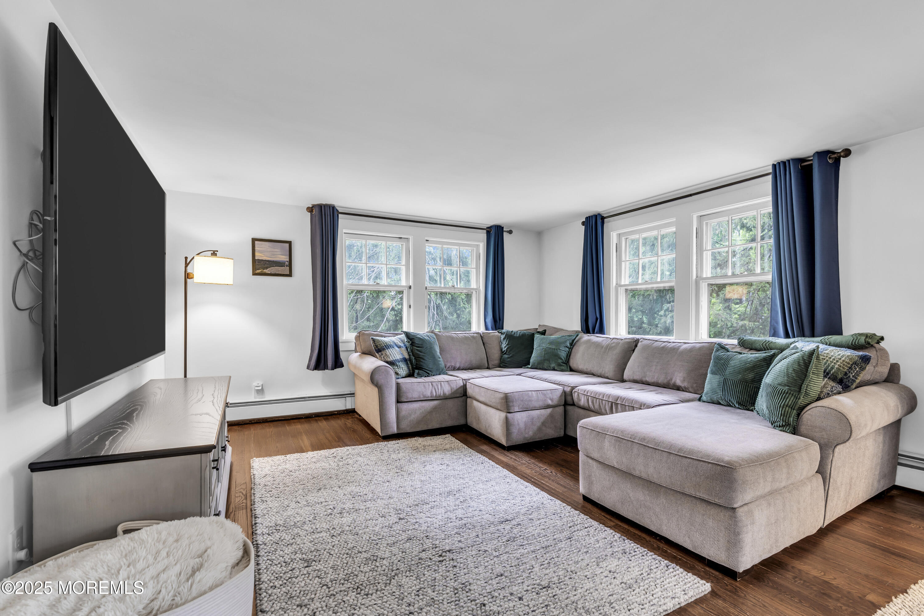 2041 Raritan Road Scotch Plains, NJ 07076 - Photo 33 of 106 a living room with furniture and a flat screen tv