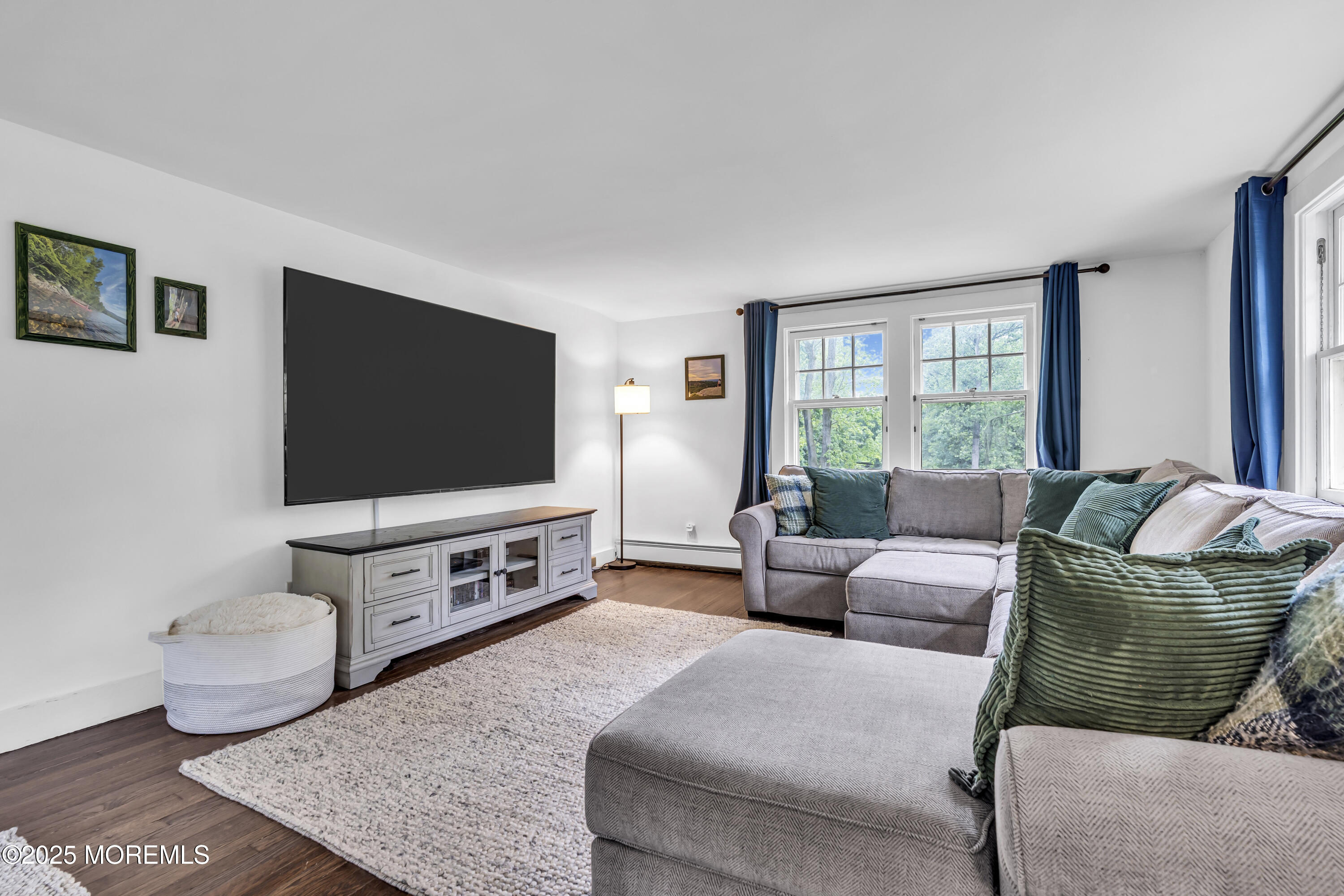 2041 Raritan Road Scotch Plains, NJ 07076 - Photo 34 of 106 a living room with furniture and a flat screen tv