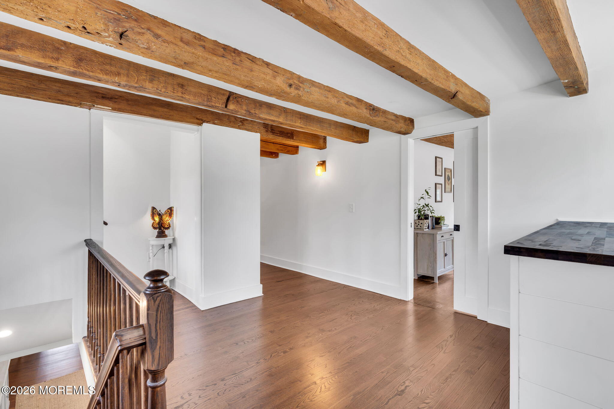 2041 Raritan Road Scotch Plains, NJ 07076 - Photo 52 of 106 a view of a hallway with wooden floor and stairs