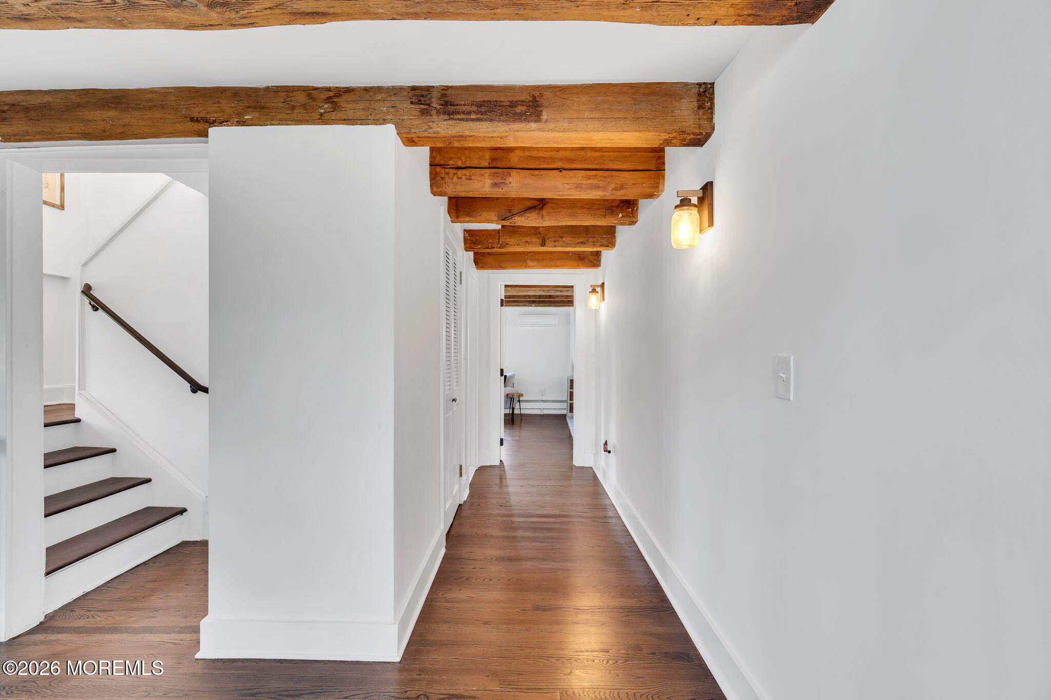 2041 Raritan Road Scotch Plains, NJ 07076 - Photo 56 of 106 a view of a hallway with wooden floor and staircase