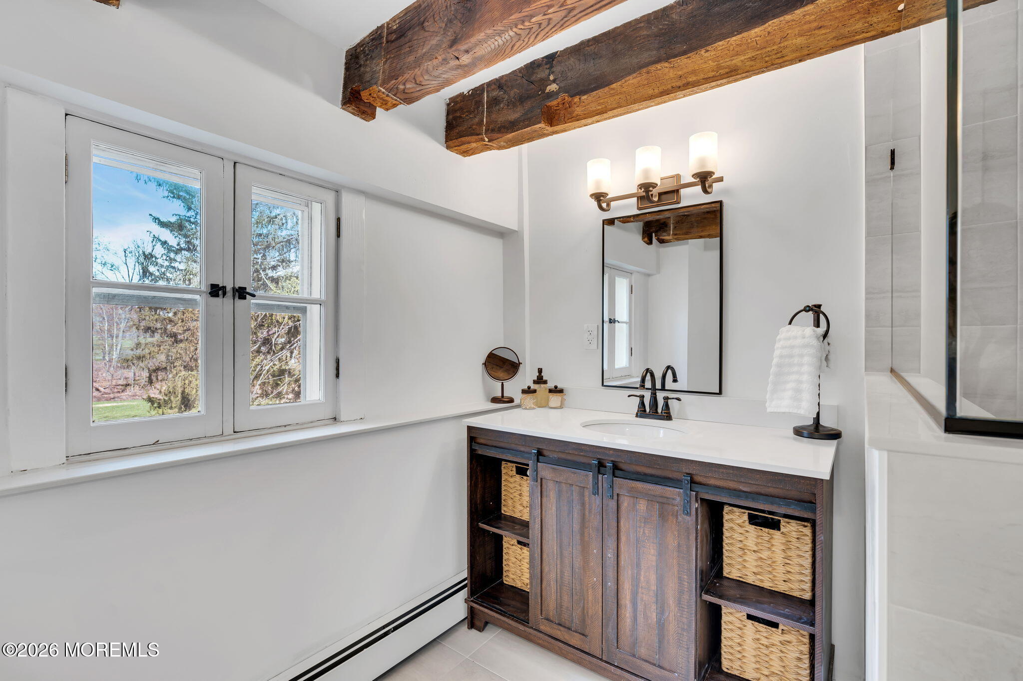 2041 Raritan Road Scotch Plains, NJ 07076 - Photo 63 of 106 a bathroom with a sink and a mirror