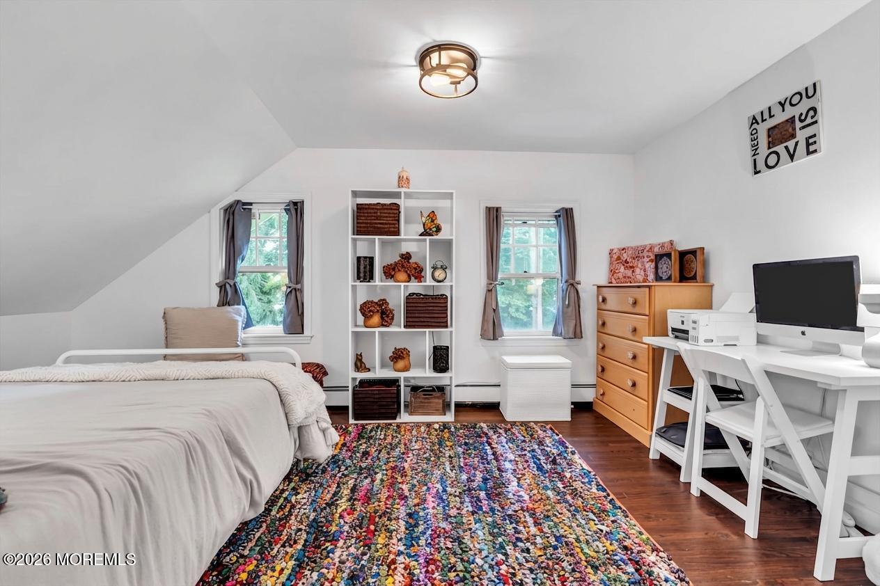 2041 Raritan Road Scotch Plains, NJ 07076 - Photo 72 of 106 a bedroom with a bed and wooden floor