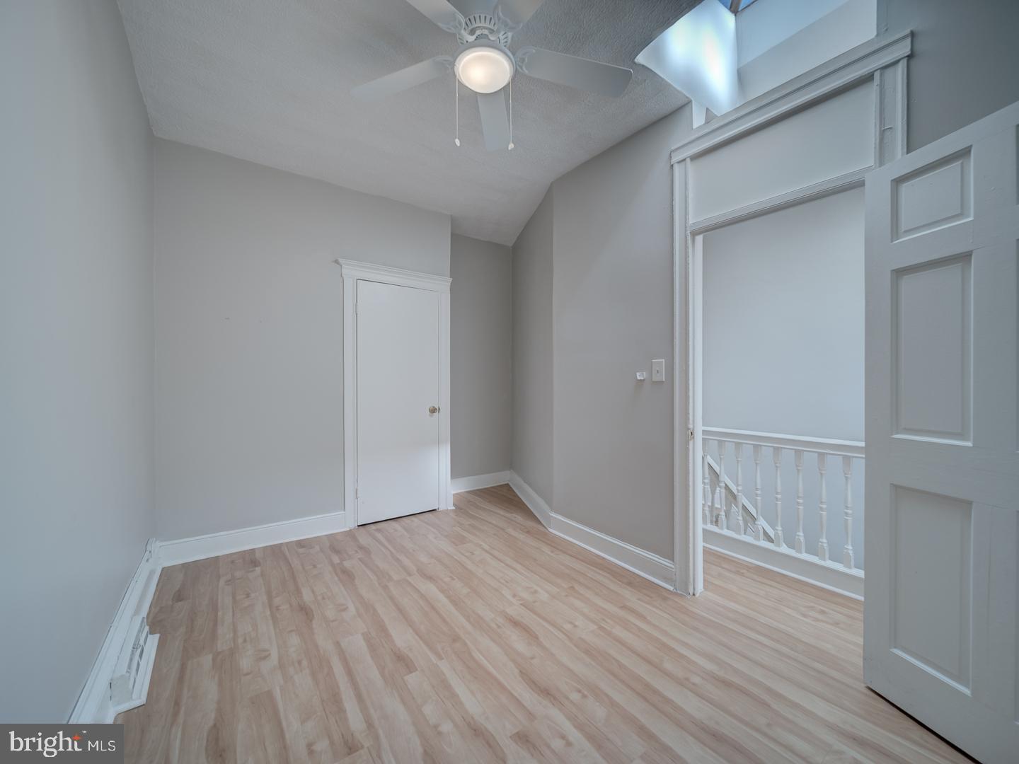 1716 Homestead Street Baltimore, MD 21218 - Photo 19 of 48 a view of an empty room with wooden floor