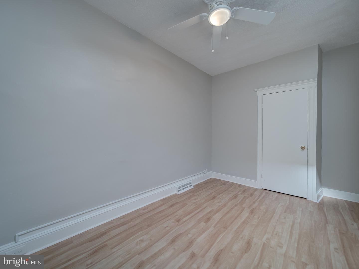 1716 Homestead Street Baltimore, MD 21218 - Photo 20 of 48 a view of an empty room with wooden floor