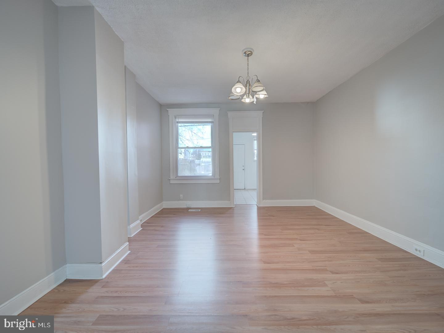 1716 Homestead Street Baltimore, MD 21218 - Photo 29 of 48 wooden floor in an empty room with a window