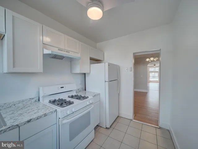 a kitchen with a sink cabinets and appliances